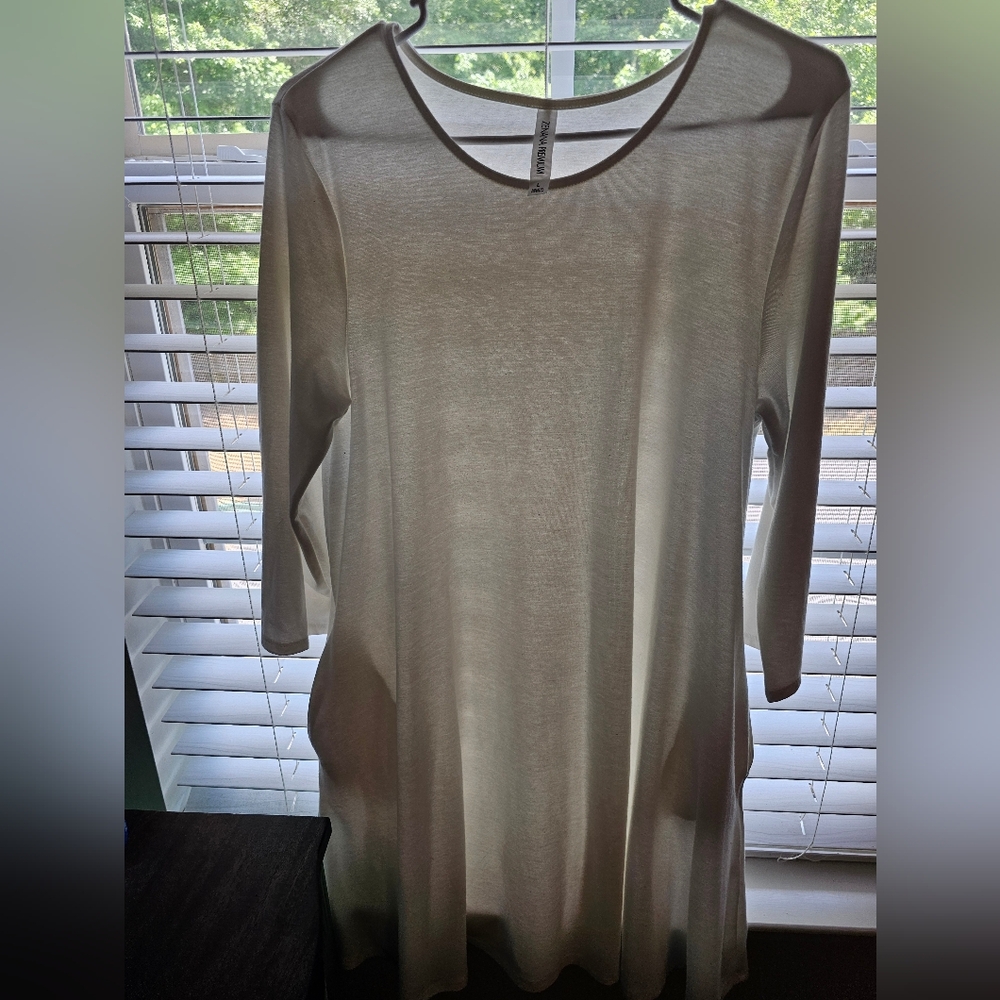 Cream colored three quarter sleeved dress